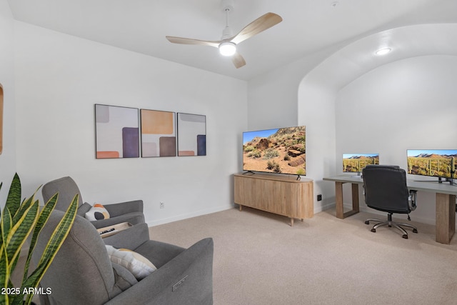 carpeted office space with ceiling fan and lofted ceiling