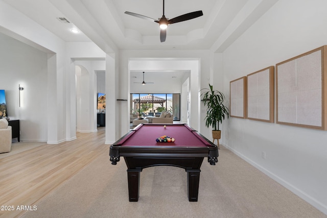 recreation room with ceiling fan, pool table, a tray ceiling, and carpet floors