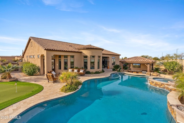 view of pool with an in ground hot tub, a gazebo, and a patio