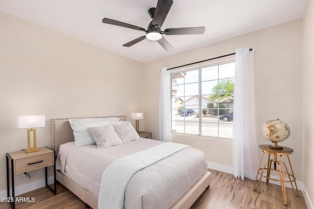 8103 E Dartmouth St, Mesa, AZ 85207 - bedroom featuring baseboards, light wood-style flooring, and a ceiling fan