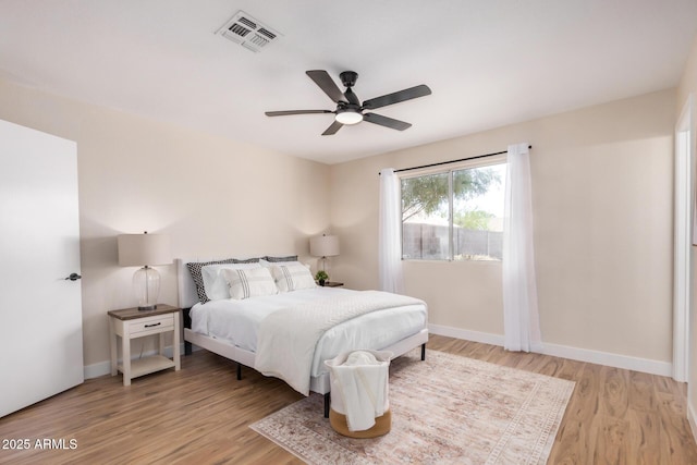 8103 E Dartmouth St, Mesa, AZ 85207 - bedroom with light wood-style floors, baseboards, and a ceiling fan