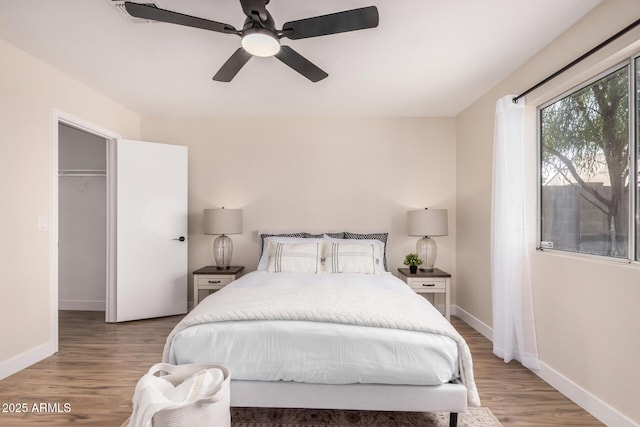 8103 E Dartmouth St, Mesa, AZ 85207 - bedroom featuring baseboards, light wood-type flooring, and ceiling fan