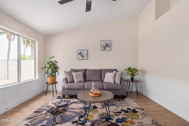 8103 E Dartmouth St, Mesa, AZ 85207 - living area with light wood finished floors, ceiling fan, and a wainscoted wall