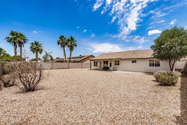 8103 E Dartmouth St, Mesa, AZ 85207 - rear view of house featuring stucco siding, a patio area, and a fenced backyard