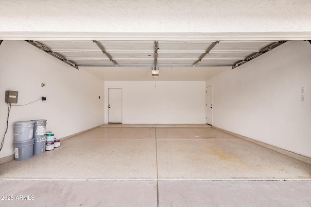 8103 E Dartmouth St, Mesa, AZ 85207 - garage with baseboards and a garage door opener