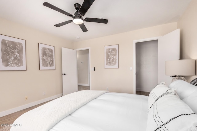 8103 E Dartmouth St, Mesa, AZ 85207 - bedroom with wood finished floors, baseboards, and ceiling fan