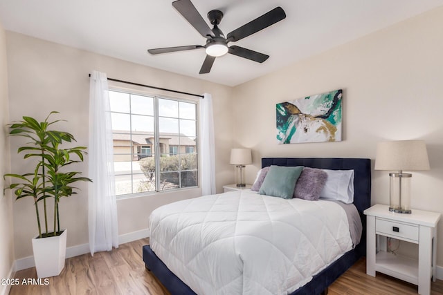 8103 E Dartmouth St, Mesa, AZ 85207 - bedroom with light wood-style flooring, baseboards, and a ceiling fan