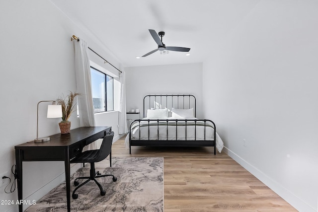 bedroom featuring wood-type flooring and ceiling fan