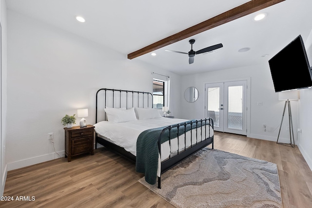 bedroom featuring french doors, access to outside, ceiling fan, wood-type flooring, and beamed ceiling