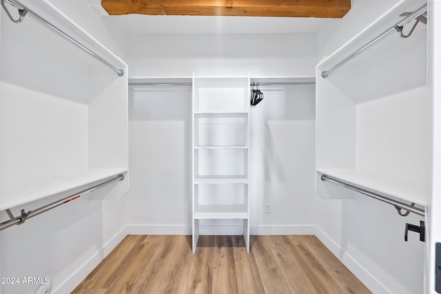 walk in closet featuring light hardwood / wood-style floors