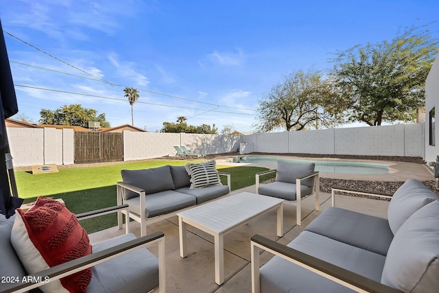 view of patio with an outdoor hangout area and a fenced in pool