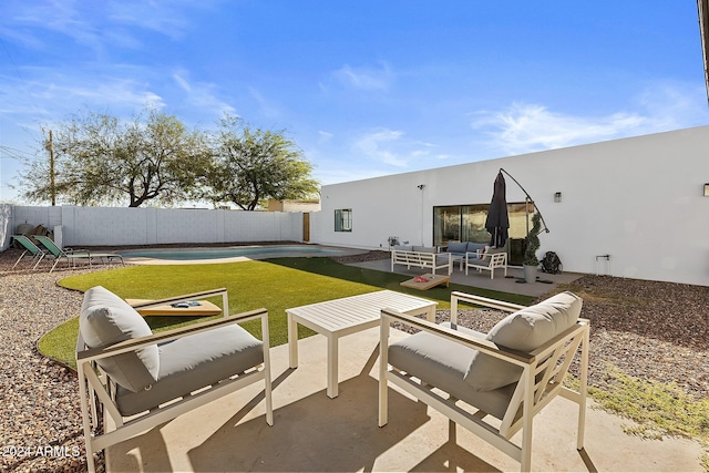 view of patio / terrace featuring an outdoor living space and a pool