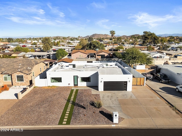 drone / aerial view featuring a mountain view