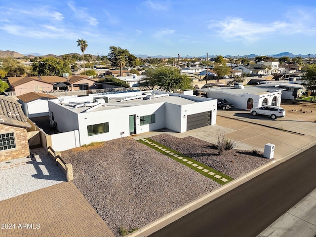 birds eye view of property featuring a mountain view