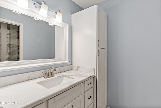 full bathroom with an enclosed shower and vanity