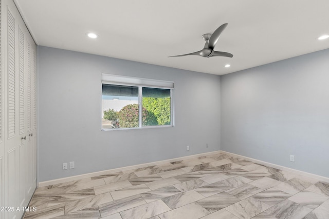 spare room featuring ceiling fan, recessed lighting, and baseboards