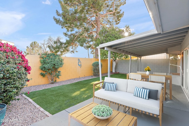 view of patio featuring a fenced backyard and an outdoor living space