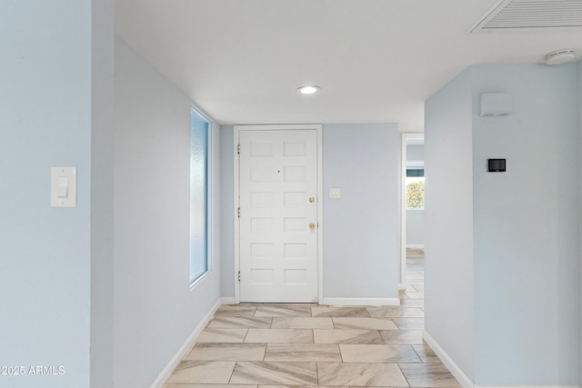 foyer with visible vents and baseboards