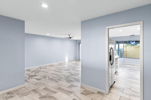 interior space featuring recessed lighting, ceiling fan, and baseboards