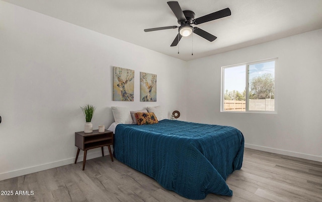 bedroom featuring ceiling fan and light wood-type flooring