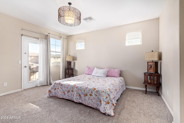 bedroom featuring light carpet