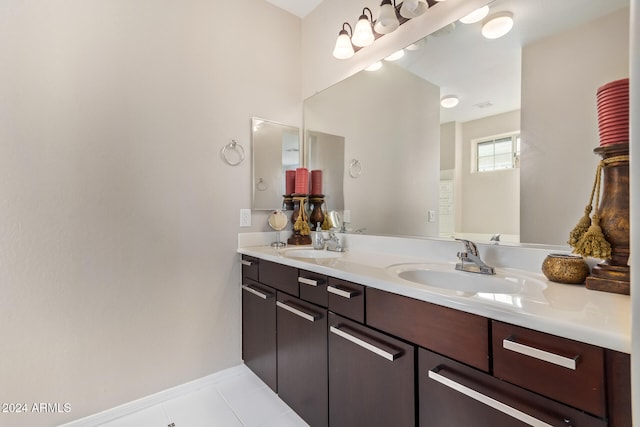 bathroom with tile patterned flooring and vanity