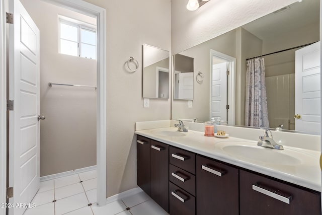 bathroom featuring tile patterned floors and vanity