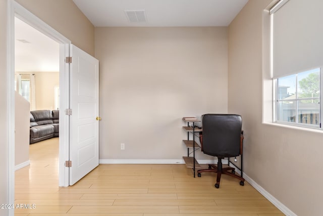 office space with light hardwood / wood-style flooring