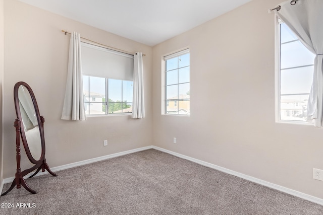 empty room with carpet flooring