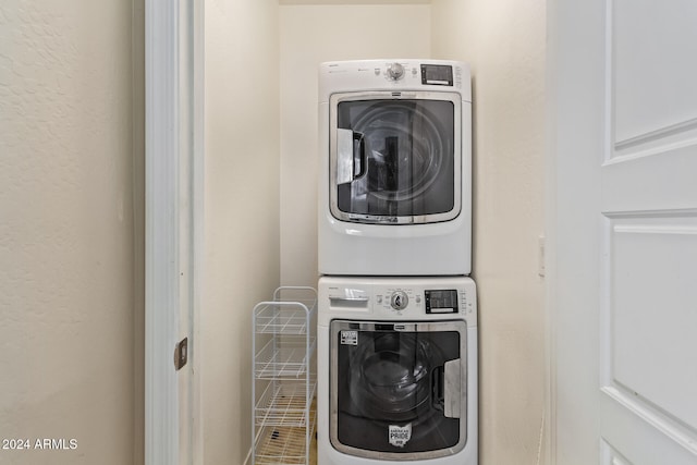 laundry room with stacked washer and dryer