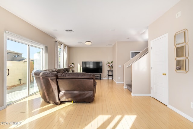 living room with light hardwood / wood-style flooring