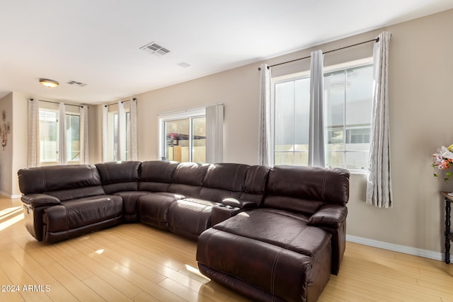 living room with a healthy amount of sunlight and light wood-type flooring