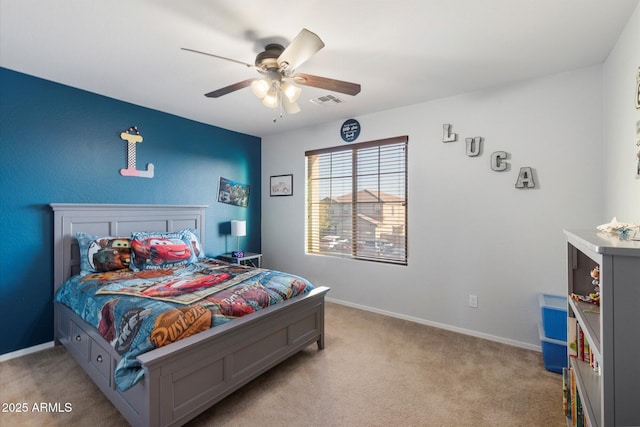 bedroom featuring visible vents, light carpet, baseboards, and ceiling fan