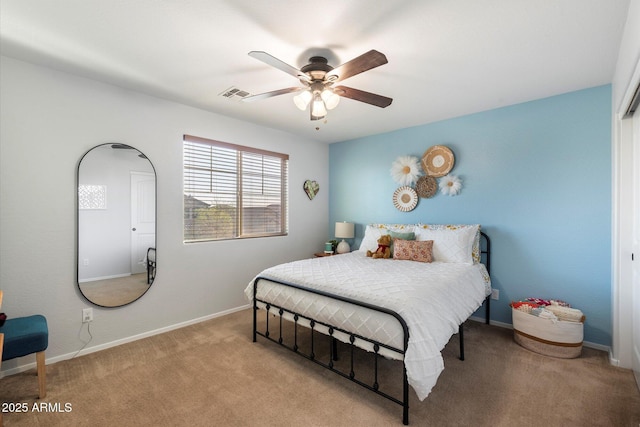 carpeted bedroom featuring visible vents, ceiling fan, and baseboards