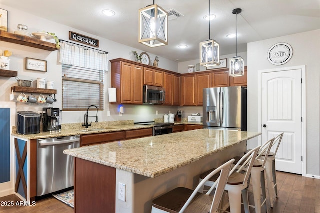 kitchen featuring visible vents, open shelves, dark wood-style flooring, a sink, and appliances with stainless steel finishes