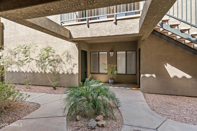 5751 N Kolb Rd Unit 7102, Tucson, AZ 85750 - property entrance with stucco siding and a balcony