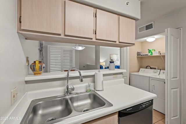 5751 N Kolb Rd Unit 7102, Tucson, AZ 85750 - kitchen featuring a sink, visible vents, washer and dryer, and light brown cabinets