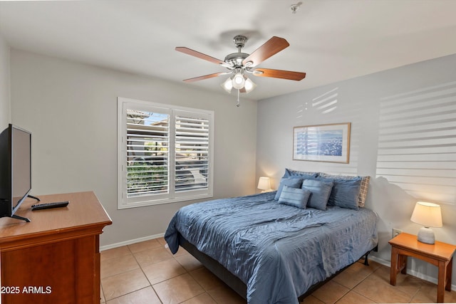 5751 N Kolb Rd Unit 7102, Tucson, AZ 85750 - bedroom with light tile patterned floors, baseboards, and a ceiling fan