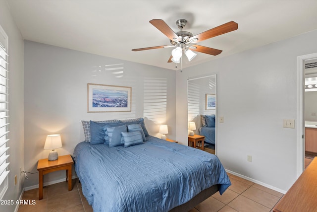 5751 N Kolb Rd Unit 7102, Tucson, AZ 85750 - bedroom with light tile patterned floors, baseboards, and a ceiling fan