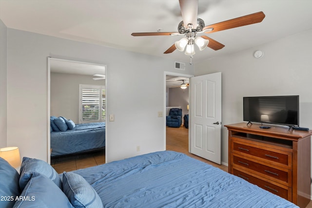5751 N Kolb Rd Unit 7102, Tucson, AZ 85750 - bedroom featuring tile patterned flooring, visible vents, and a ceiling fan
