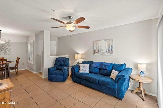 5751 N Kolb Rd Unit 7102, Tucson, AZ 85750 - living room featuring light tile patterned floors, baseboards, and a ceiling fan