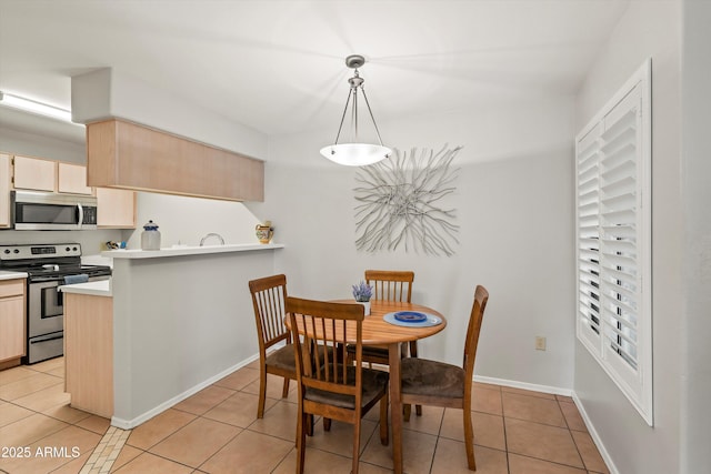 5751 N Kolb Rd Unit 7102, Tucson, AZ 85750 - dining room with light tile patterned floors and baseboards