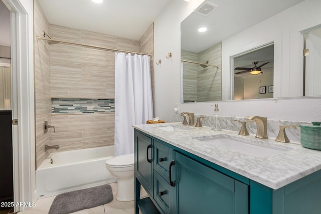 full bathroom with toilet, vanity, shower / bath combo with shower curtain, ceiling fan, and tile patterned flooring