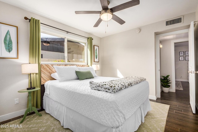 bedroom featuring dark hardwood / wood-style flooring and ceiling fan