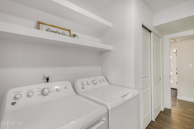 washroom featuring dark hardwood / wood-style floors and separate washer and dryer