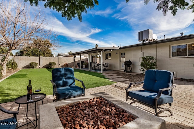 view of patio / terrace featuring a grill, central AC, and a fire pit