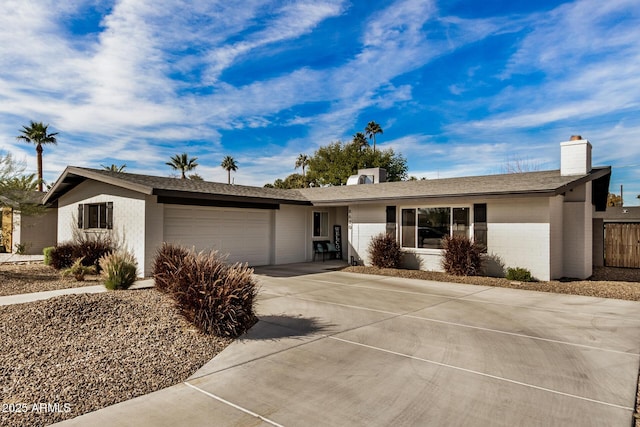 ranch-style house featuring a garage