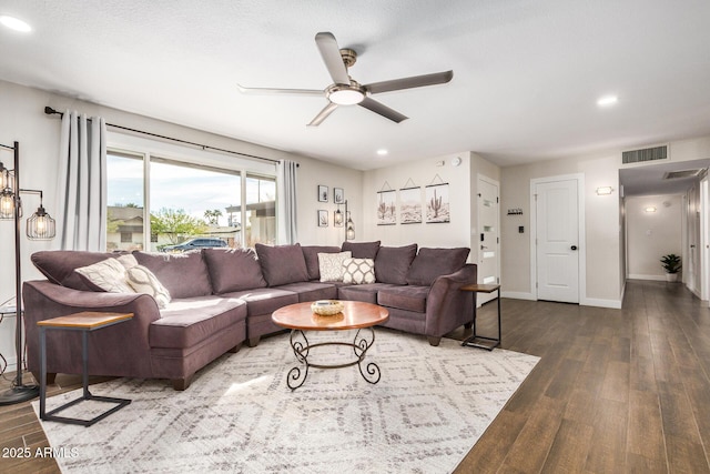 living room featuring hardwood / wood-style flooring and ceiling fan