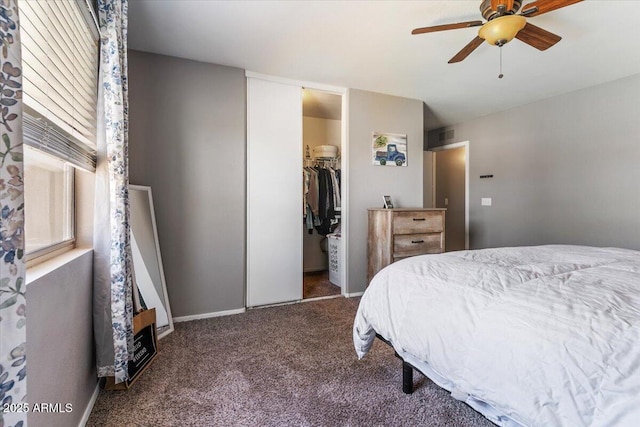 1057 E Silversmith Trl, San Tan Valley, AZ 85143 - bedroom with carpet floors, a closet, a spacious closet, and a ceiling fan