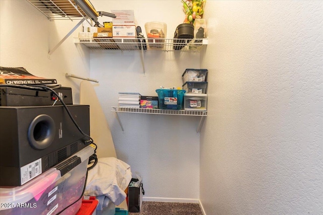 1057 E Silversmith Trl, San Tan Valley, AZ 85143 - laundry room with carpet and stacked washer / dryer